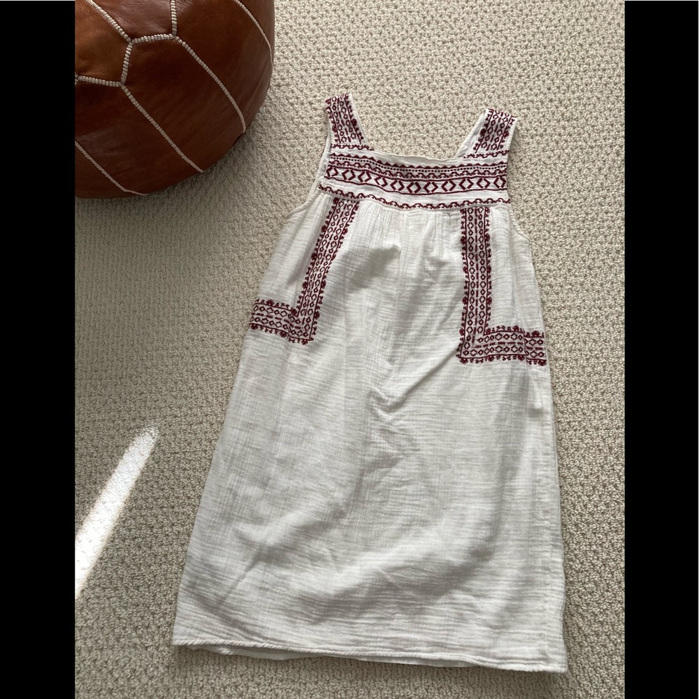White dress with red detailing
